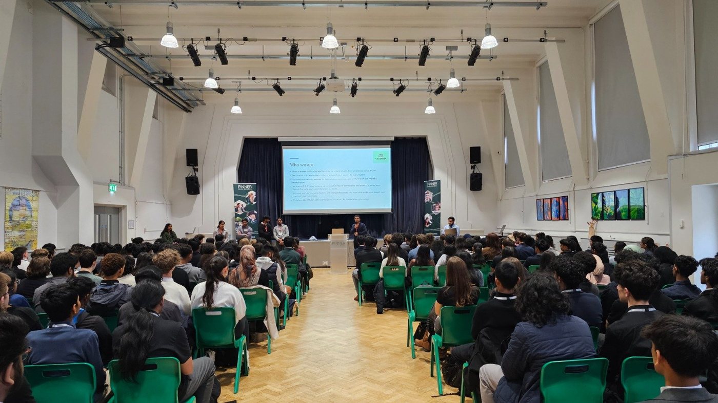 1-2-1 Tutors delivering a whole-school assembly