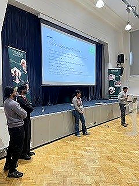 The 1-2-1 Tutors team presenting to students